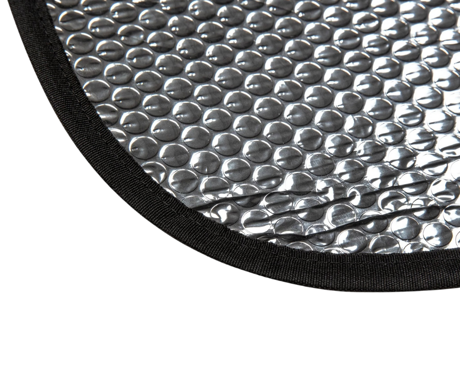 Close-up of a textured silver mat with black border on a white background